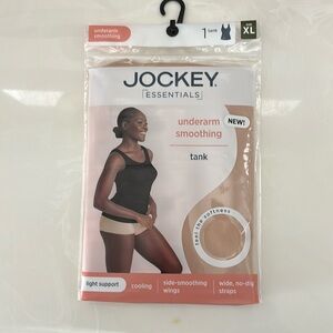 Under arm, smoothing tank by jockey. Color nude.